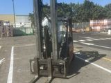 a forklift that is parked in a parking lot