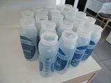 many bottles of water sitting on a table