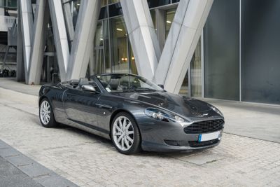 a grey car parked on the side of the street