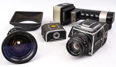 many different types of cameras on a white surface