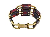 a close up of a bracelet on a white background