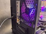 a black computer case with a purple light on it