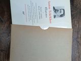 a card with a picture of a man on it on a wooden table