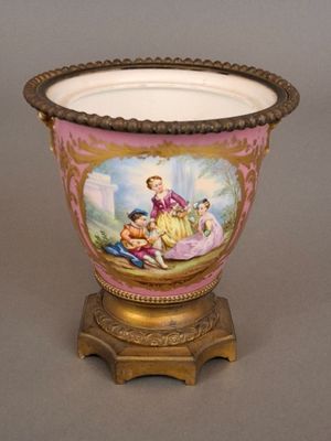 a vase with a painting on it sitting on a stand