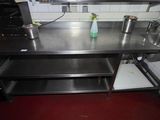 a kitchen with a sink, stove, and microwave in it