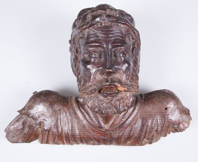 wooden bust of a man with a beard and a hat