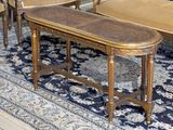 a table and chairs in a room with a rug on the floor