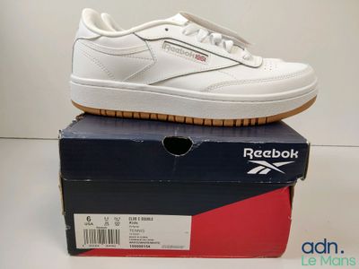a box with a pair of shoes on top of it