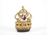 an image of a gold crown with a pink stone in it