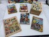 a lot of comic books on a table