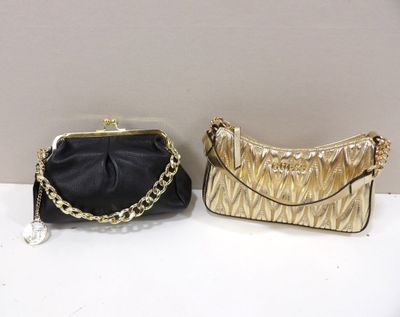 gold and black purses on a white table