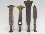 three different types of knives on a white surface