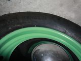 a close up of a tire with a green rim