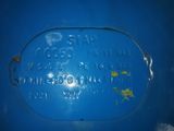 a close up of a blue sign on a wall