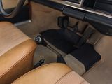 dashboard of a car with tan leather seats and a black steering wheel