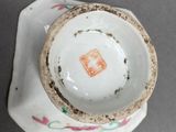 a small cup and saucer sitting on top of a table