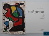 an open book with a picture of a painting on it