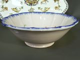 a white bowl with a blue and white design on it