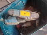 a blue box with a hammer and other tools in it
