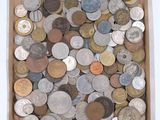 an open box filled with lots of different types of coins