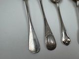 five spoons and two spoons on the table