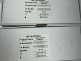 three boxes of qa certifications on a table