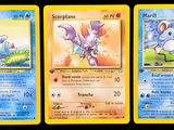 three pokemon cards with different designs on them on a black background