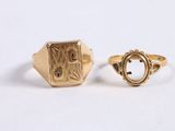 an image of two gold rings on a white surface