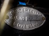 a close up of a metal plate with a name on it