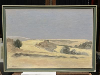 un tableau représentant une scène de désert, exposé dans un musée