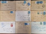 many old envelopes on a table with stamps on them
