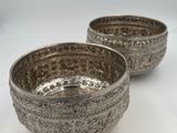 pair of silver plated bowls on white background with white background