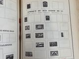an open book with a bunch of stamps on it