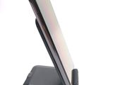 a cell phone that is sitting on top of a stand