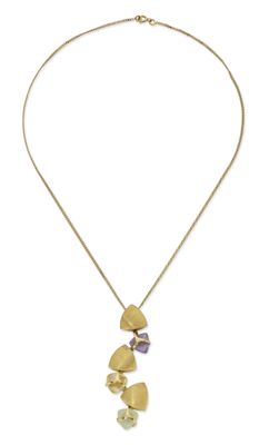 a gold necklace with a heart shaped pendant and a purple stone