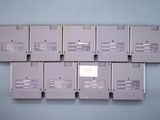 many floppy disks stacked on top of each other on the wall