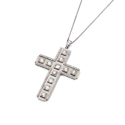 a close up of a cross on a white background with a chain