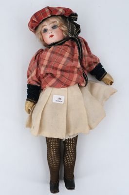 an image of a doll with a hat and a skirt