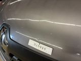 a close up of a car with a sticker on it ' s hood