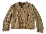 the jacket is tan and has buttons on the collar