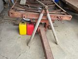 a pile of tools sitting on the floor in a garage