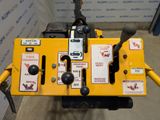 a close up of a yellow machine with stickers on it