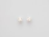 a pair of diamond stud earrings on a white background