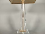 a lamp that is on top of a clear table