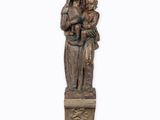 an image of a statue of a woman holding a child