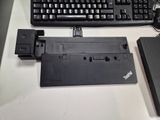 a keyboard and a mouse on a desk next to a laptop