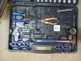 many tools in the case on the floor next to each other