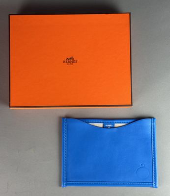 an orange and blue box and a blue wallet sitting next to each other