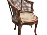an image of a wooden chair with wicker seat on a white background