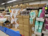 many boxes and cups on the shelves in the store